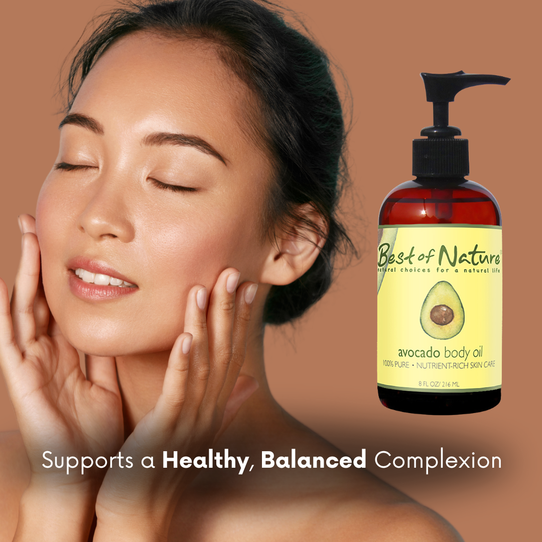 Woman touching her face with a bottle of 'Best of Nature' avocado body oil on a brown background