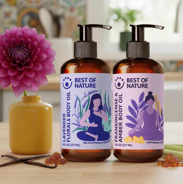 Two bottles of 'Best of Nature' body oil on a table with a blurred background